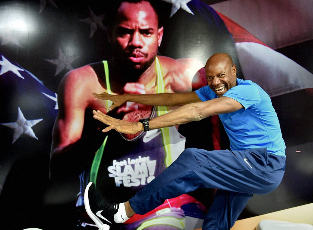 Long jump legend Mike Powell in an animated mood during a media briefing. PTI photo