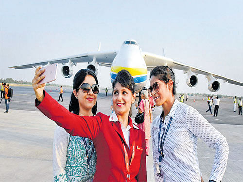 Girls take a selfie in front of the world's largest cargo aircraft, Antonov AN -225 Mriya or the Dream, which made its first landing at the Rajiv Gandhi International Airport in Hyderabad on Friday. PTI
