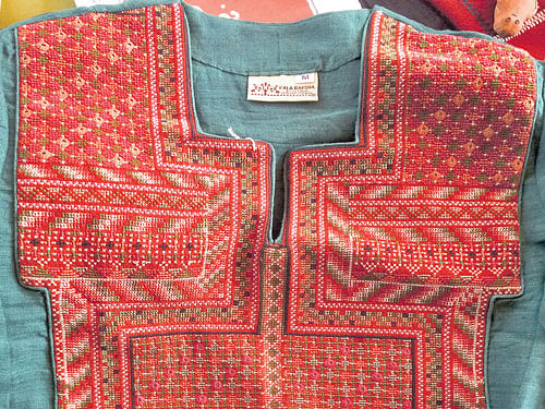 coloured variety :  A Garasia Jat tunic embroidered with cross-stitch and mirrors