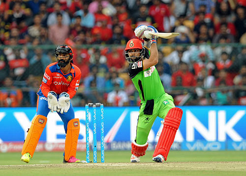 Skipper Virat Kohli and AB de Villiers blazed away to unbeaten centuries as RCB notched up a record 144-run win over Gujarat Lions. DH Photo