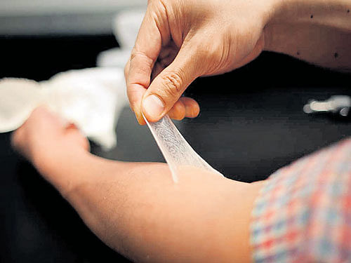 age no problem: A manufactured polymer 'second skin' being peeled off of a forearm. Scientists at Harvard and the Massachusetts Institute of Technology say an invisible film composed of polymers that can be painted on the skin, could make bags under the eyes, wrinkles and other dermatologic problems vanish. nyt