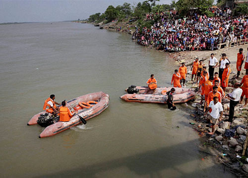 NDRF rescue operation is carried out in Ganga River in Burdwan on Sunday after a boat capsized overnight in Kalna, Burdwan district, West Bengal on Saturday night. PTI Photo