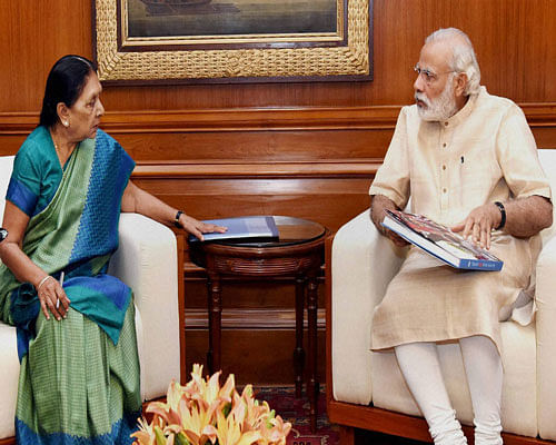 Prime Minister Narendra Modi in a meeting with Chief Minister of Gujarat, Anandiben Patel in New Delhi on Monday. PTI Photo