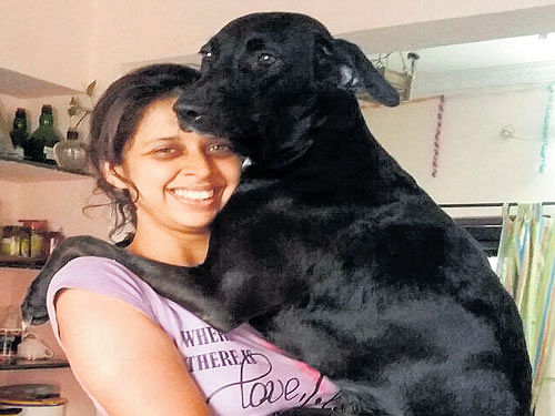 caring Ashwini Pailoor and her dog.