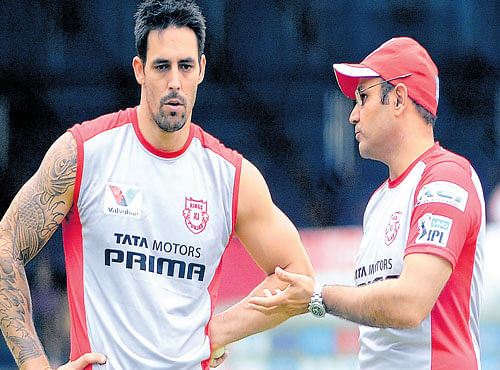 PACE STORY: Kings XI Punjab's mentor Virender Sehwag (right) has aword with Mitchell Johnson. DH PHOTO