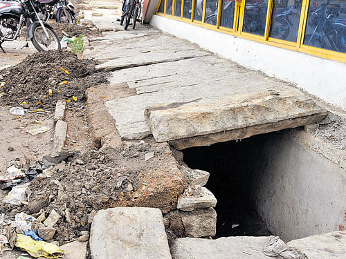 Desilting of the drains is not done regularly and this leads to flooding during rains. dh file photo