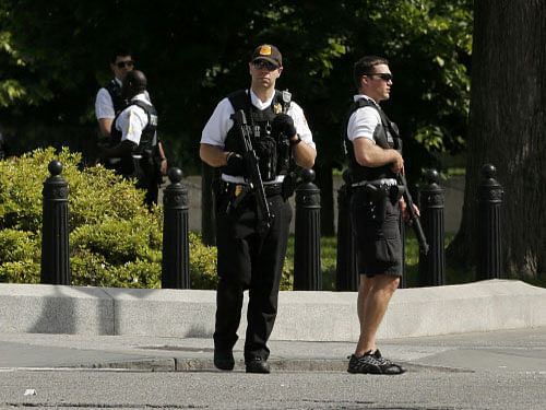 Secret Service agents stand guard after a shooting incident near the White House in Washington DC. Reuters photo