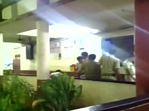 According to Rakesh Shetty, who captured the episode on his mobile phone camera, the incident took place on May 11 when the woman and her husband reached the police station for a complaint. Screengrab from ANI Video