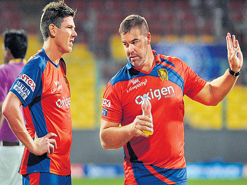 do this... Gujarat Lions coach Heath Streak (right) has a word with James Faulkner on the eve of their match against Royal Challengers Bangalore. DH photo/ srikanta sharma r