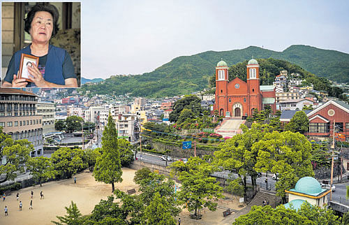 City of the abandoned: The rebuilt Urakami Cathedral in Nagasaki, the oldest and densest stronghold of Roman Catholicism in Japan. (inset) Miyako Jodai, 76, a survivor of the atomic bombing of Nagasaki. That the city was bombed after Hiroshima during World War II has made it an afterthought in the history of and debate over nuclear weapons, making some there feel that Nagasaki has been overlooked. NYT