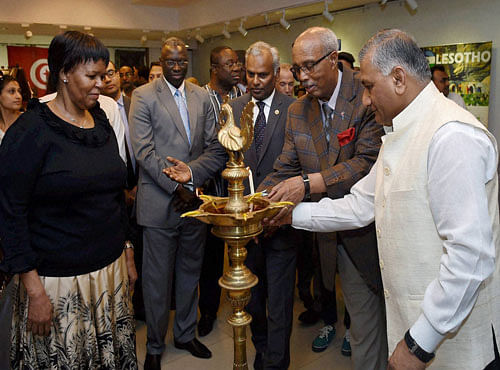 Mos for External Affairs V K Singh with Dean of Group of African Heads of Mission, Alem Tsehaye Woldemariam lights the lamp to inaugurate an exhibition as part of the Africa Day Celebration at ICCR in New Delhi on Thursday. PTI Photo