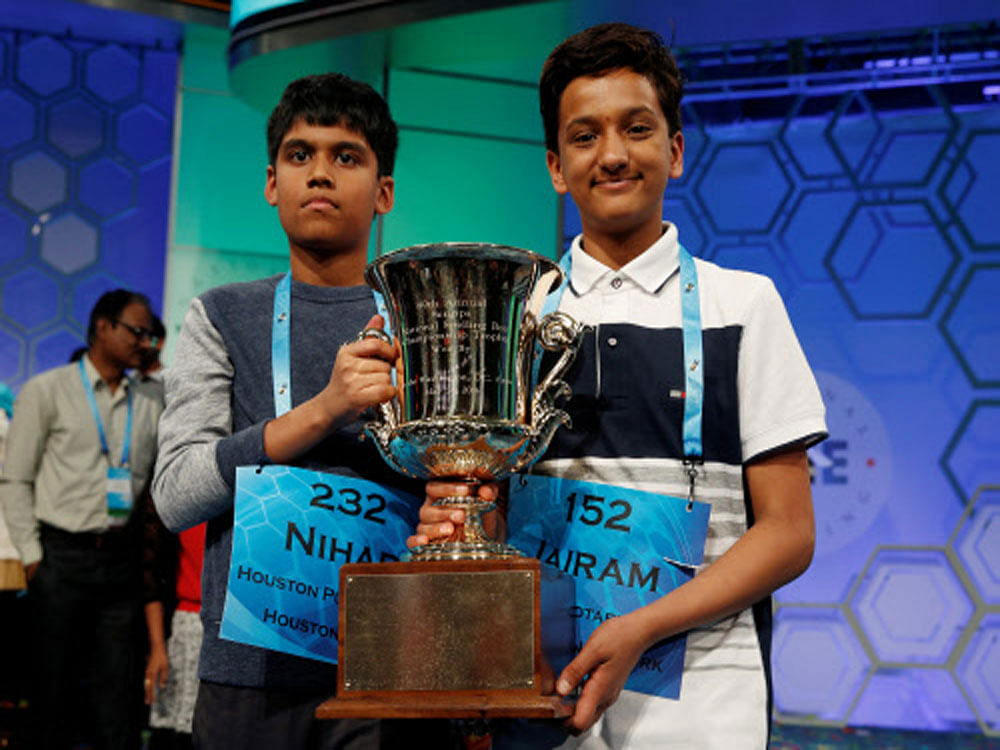 Co-champions Nihar Saireddy Janga (L) and Jairam Jagadeesh Hathwar hold their trophy upon completion of the final round of Scripps National Spelling Bee at National Harbor in Maryland. Reuters photo