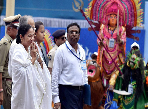 West Bengal Chief Minister Mamata Banerjee arrives at her swearing-in ceremony in Kolkata on Friday. PTI