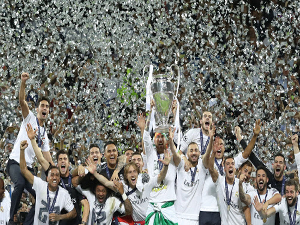 Real Madrid's Sergio Ramos lifts the trophy as they celebrate winning the UEFA Champions League. Reuters photo