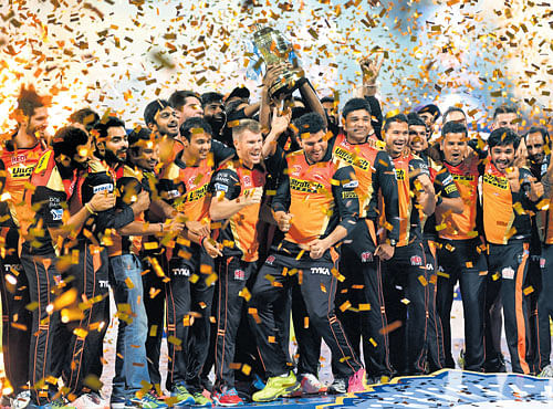 Sun also rises: Sunrisers Hyderabad's players celebrate with the trophy after defeating Royal Challengers in the IPL final in Bengaluru on Sunday. DH Photo/Srikanta Sharma R