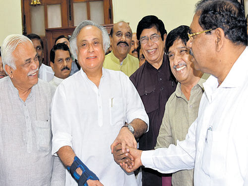 Congress candidates, former union ministers Jairam Ramesh, Oscar Fernandes and  former IPS officer K C Ramamurthy, share a lighter moment after filing their nominations for the Rajya Sabha elections in the city on Monday. State Ministers R V Deshpande and  G Parameshwara are seen. DH Photo
