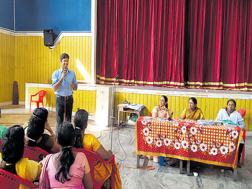 Jinoj addresses participants in a Project Ritu awareness campaign programme.
