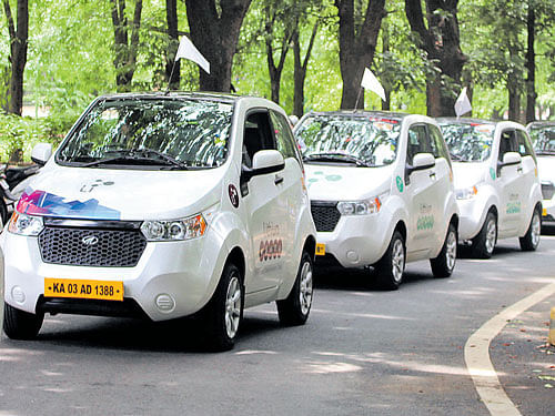 Electric cars take part in a rally to spread awareness about the environment. dh pHOTO