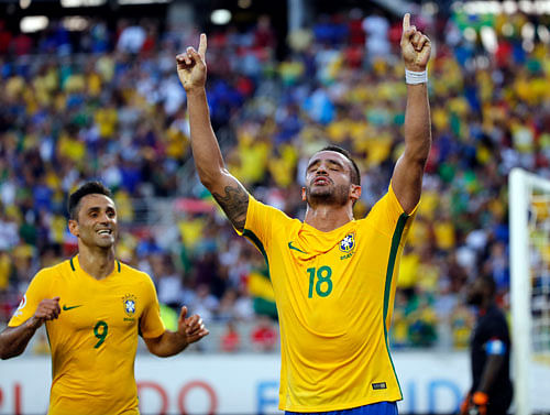 TO THE ONE ABOVE: Brazil's Renato Augusto celebrates after scoring against Haiti in the Copa America on Wednesday. REUTERS