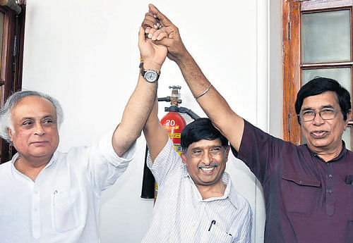 Congress candidates Jairam Ramesh, K C Ramamurthy and Oscar Fernandes after the results were declared at Vidhana Soudha in Bengaluru on Saturday. DH Photo/M S MANJUNATH