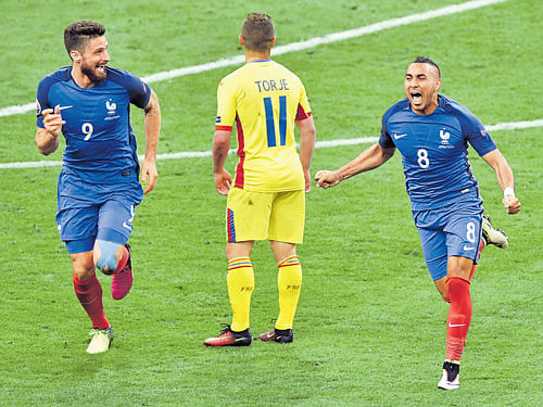 scorcher: France's Dimitri Payet (right) sets off for a celebratory run after scoring the winner against Romania. AFP