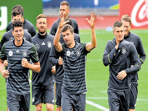 Key Men: Thomas Mueller (centre) will spearhead the German front line with the likes of Mario Gomez (left). AFP