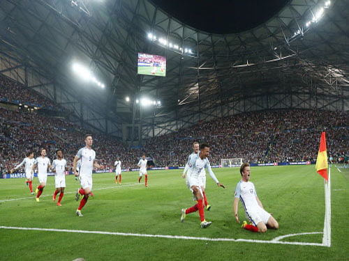 England's Eric Dier celebrates with teammates after scoring against Russia in their Euro 2016 opener in Marseille. Reuters photo