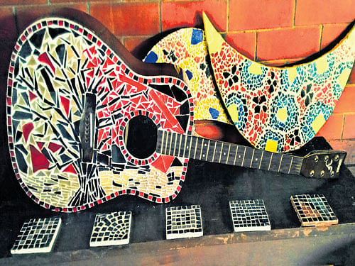 vibrant An unused guitar with mosaic glass and (below) some of the other creations.