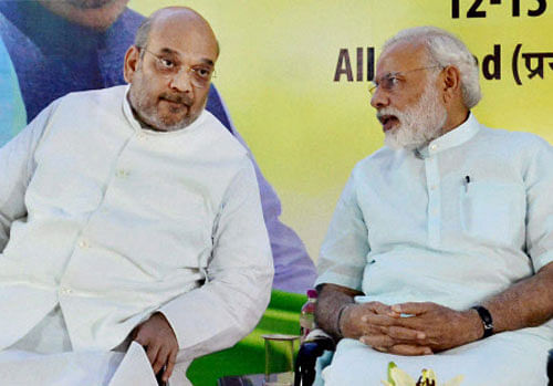 Prime Minister Narendra Modi and BJP's national president Amit Shah during the party's national executive meet in Allahabad on Sunday. PTI Phot