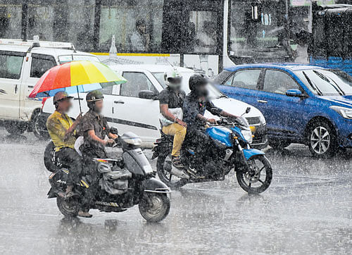 struggling Poor infrastructure in the city makes life difficult for commuters during  the rains.