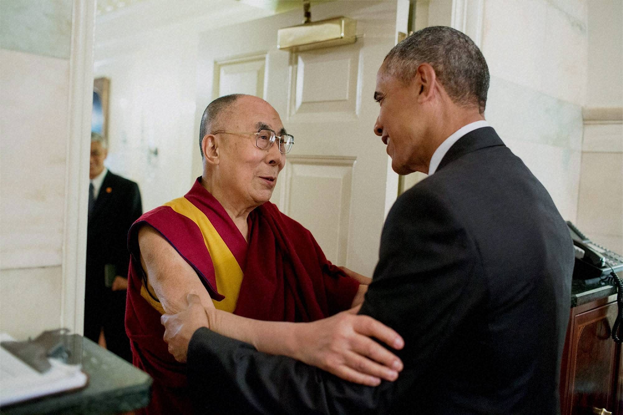 US President Barack Obama greets Tibetan spiritual leader Dalai Lama at the entrance of the Map Room of the White House in Washington on Wednesday. PTI Photo