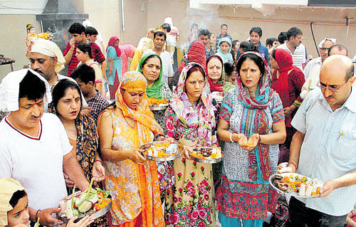 Yearning for homeland: Kashmiri Pandits offer prayers at the replica of Kheer Bhawani temple during the annual Kheer Bhawani Mela in Jammu on Sunday. The authorities have said they would set up secure enclaves for returning migrants where they can live safely, but the plan has hit a roadblock, with many accusing the government of trying to create