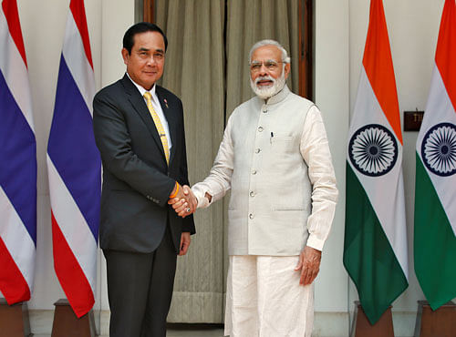 Thailand's Prime Minister Prayuth Chan-ocha shakes hands with his Indian counterpart Modi during a photo opportunity at Hyderabad House in New Delhi. Reuters photo