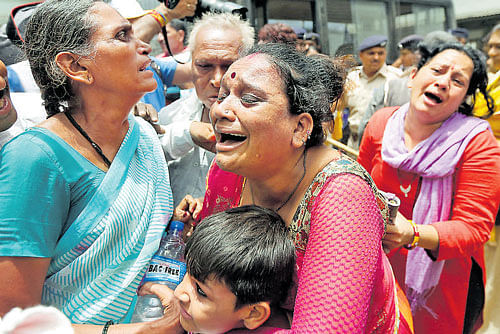 Relatives of those convicted in the Gulberg Society massacre case cry outside a court after the sentencing in Ahmedabad on Friday. REUTERS