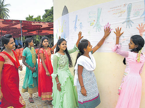 Child activists of Hasiru Dala and Clean City Recyclers' Association take part in the Hasiru Habba at the Freedom Park in Bengaluru on Friday. Dh PHOTO