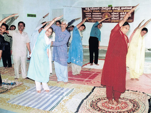 dedicated Tanaji Chauhan conducting a yoga session in Dharwad.