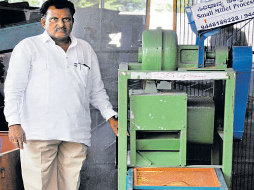 innovative Manohar with a millet-processing machine