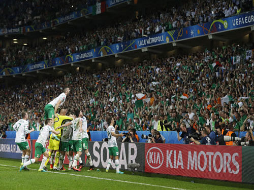 Republic of Ireland players celebrate with fans at the end of the match. Reuters photo