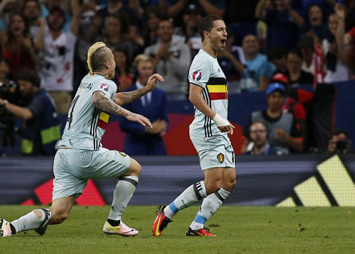 Belgium's Eden Hazard celebrates with Radja Nainggolan after scoring their third goal. REUTERS