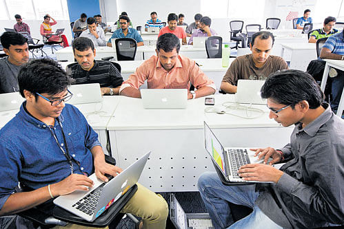 larger workforce: Workers train at Flipkart in Bengaluru. The Centre announced sweeping changes to throw open its economy to FDI, allowing foreign investors to establish 100% ownership in companies involved in defence, civil aviation and food products, with approval. nyt