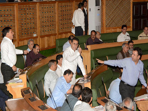 BJP MLAs shout slogans at a protest against Pampore militants attack during the budget session in Srinagar on Monday. PTI Photo