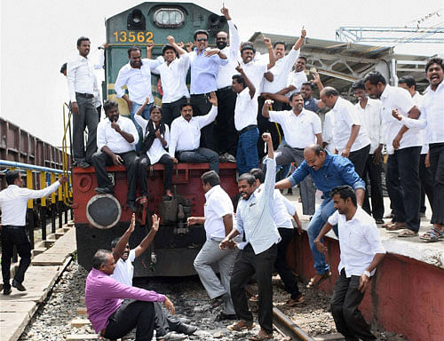 Fighting for rights: Advocates stage a 'Rail Roko' protest demanding a recall of the amendments of Advocates Act at Madurai Railway junction on Wednesday. PTI
