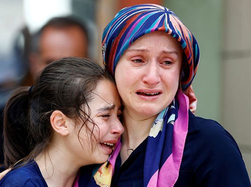Relatives mourn a victim of the blast at Ataturk Airport in Istanbul on Wednesday. REUTERS