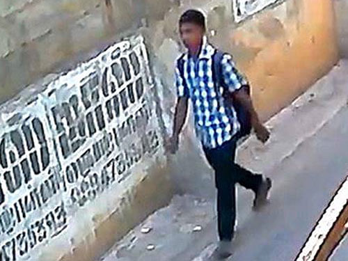 Police released a 'file photo' of the man, saying it had been 'developed' by them. The photo shows a man wearing blue shirt and black pants, similar to what was seen in the CCTV footage released by the police on Sunday. Image courtesy Twitter