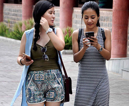 Students arrive to check their names in the first cut off list of Delhi University on Tuesday. PTI