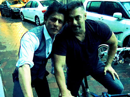 While Salman, 50, is casually dressed in blue denims and black t-shirt, SRK is wearing formals. Photo credit: twitter