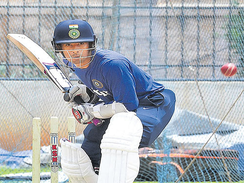 EYES&#8200;ON THE BALL Indian wicket-keeper Wriddhiman Saha at a training session on Friday. DH photo/ Srikanta sharma r