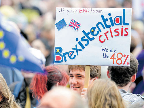 A man holding a banner during a demonstration against Britain's decision to leave the European Union. Reuters