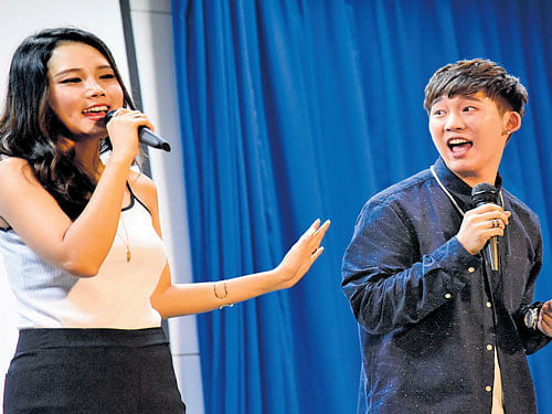 enthusiastic Korean Singers Hayana and Dabit singing at the regional round of the 'K-POP Contest India 2016' at St Joseph's College (Autonomous).  DH Photos by B H Shivakumar