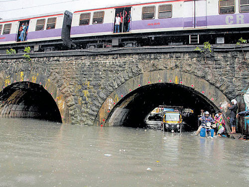 A waterlogged underpass following heavy downpour in Thane, Mumbai on Monday. PTI